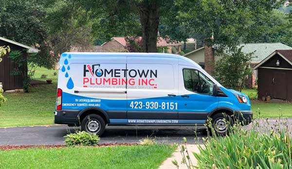 Hometown Plumbing van with logo on the side.